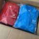 Polos rojos y azules personalizados de la Ryder Iberia vs Air Europa preparados para entregar