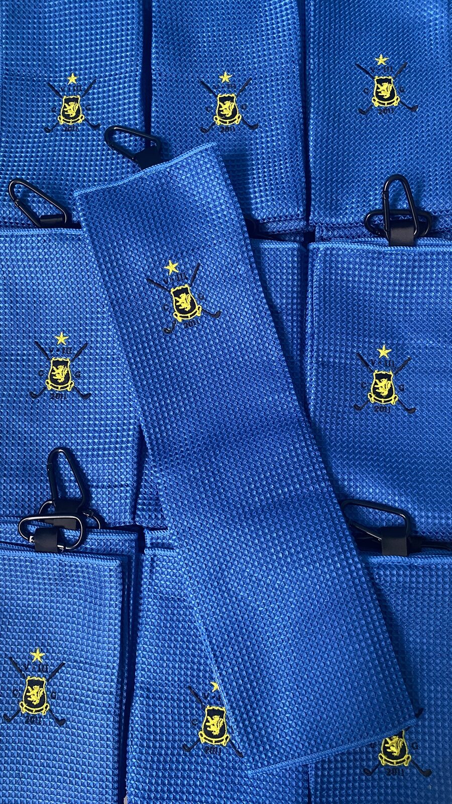 Toallas personalizadas como regalo de bienvenida en un torneo de golf